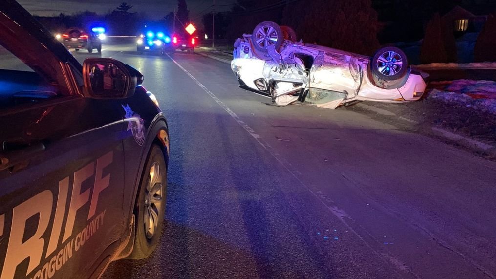 Image depicting a late night minor car accident at night with two slightly damaged vehicles on a dimly lit road, highlighting the challenges of nighttime driving.