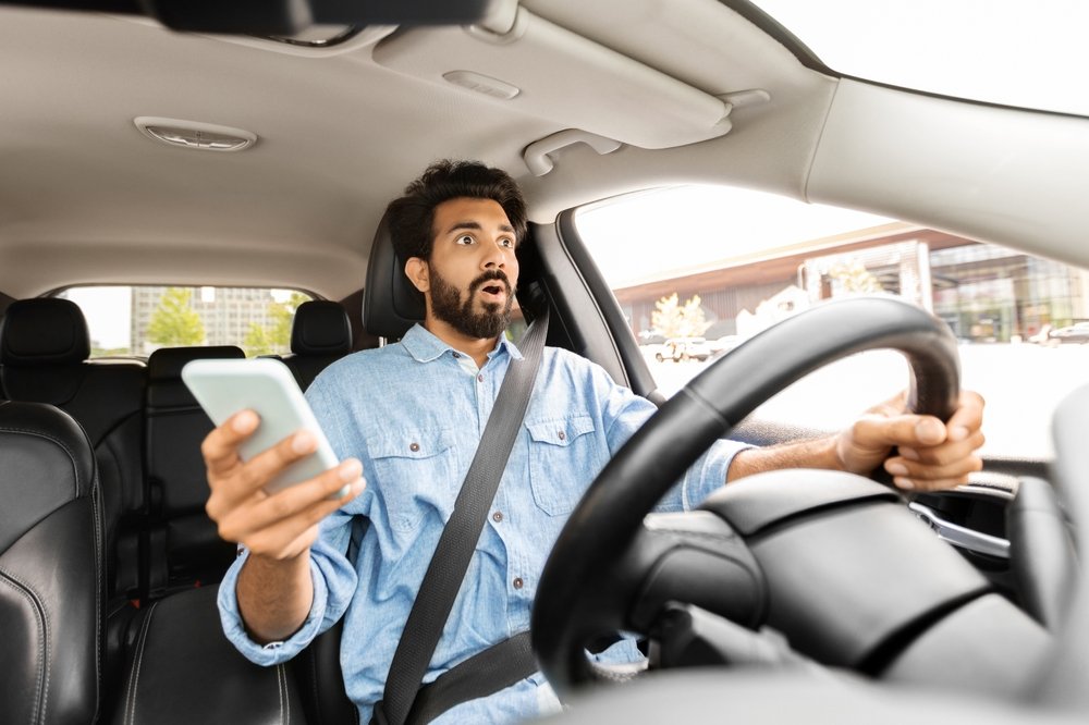 Distracted driving accident lawyer consulting with a client in a professional office, reviewing legal documents and offering expert advice to help secure compensation after an accident